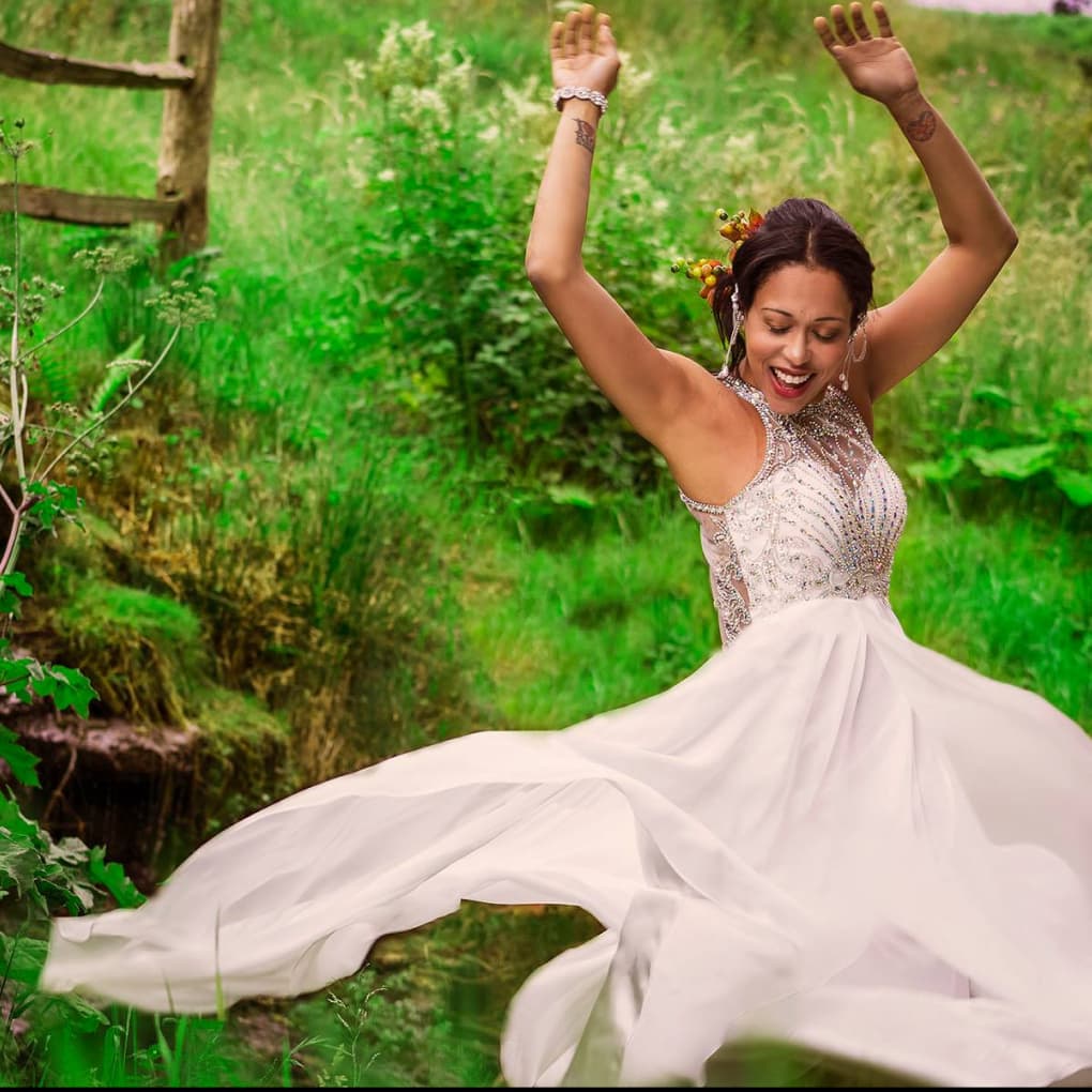 A woman in a bridal outfit by Eathelin's waterfall