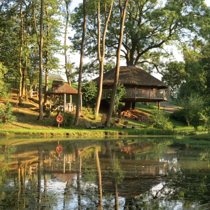 View of Vivianna and outdoor hot tub area from across the lake