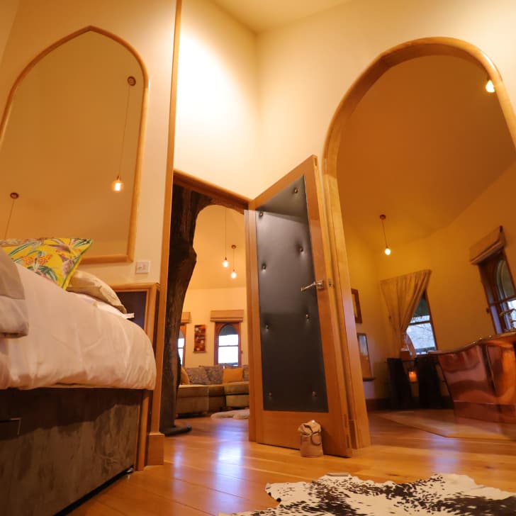 Master bedroom and copper bathtub with view into the siting room area 